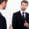 Man in suit, mirror, gender bias