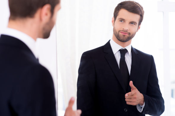 Man in suit, mirror, gender bias