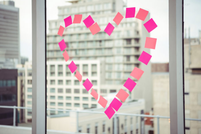 heart on an office window, workplace relationships