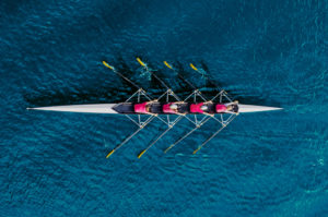 a rowing team on a river