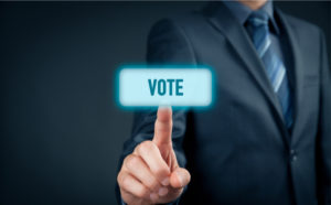 Businessman voting electronically