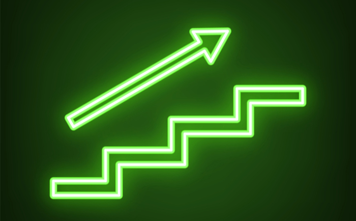 Neon green arrow over staircase