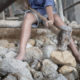 Child labourer breaking rocks