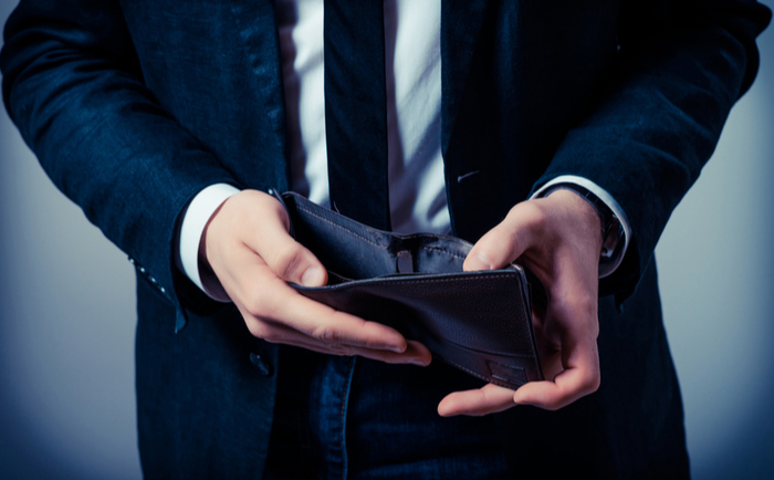 Businessman looking in his wallet