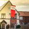 Taylor Wimpey development with logo flag