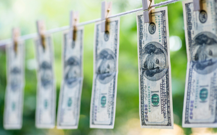 Money laundering dollars on washing line