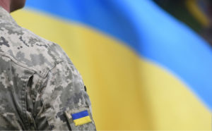 Ukrainian soldier and flag
