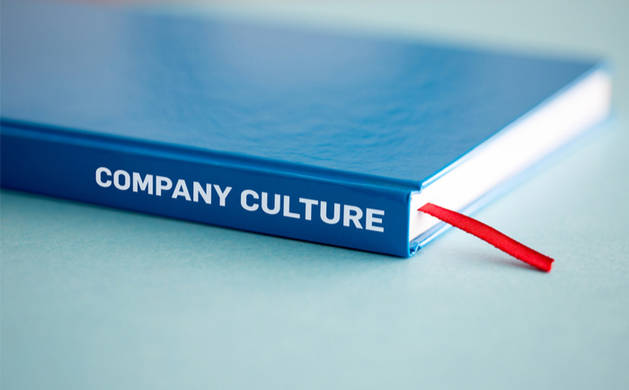 Book marked "company culture"